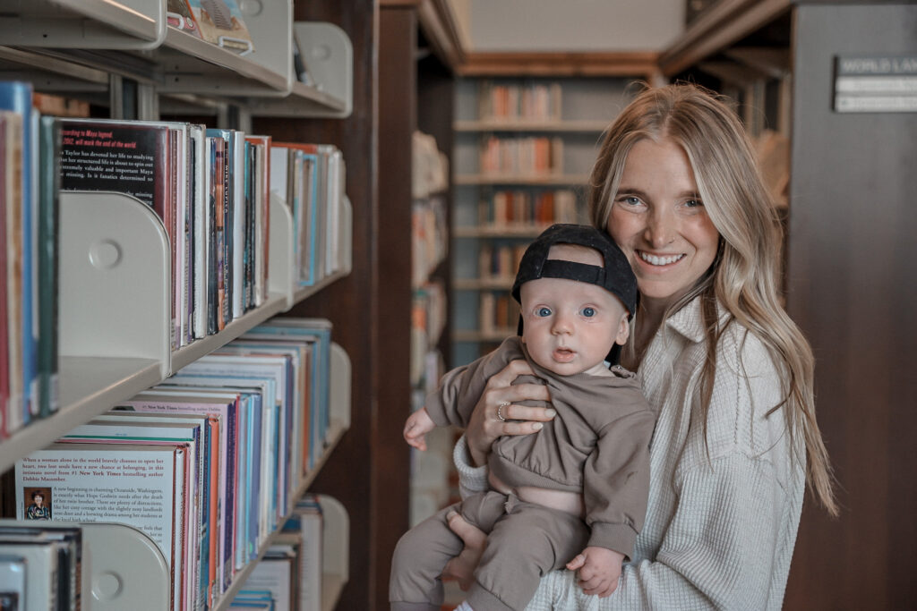 Mom holding her son in a library