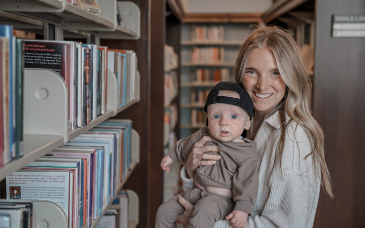 Mom holding her son in a library