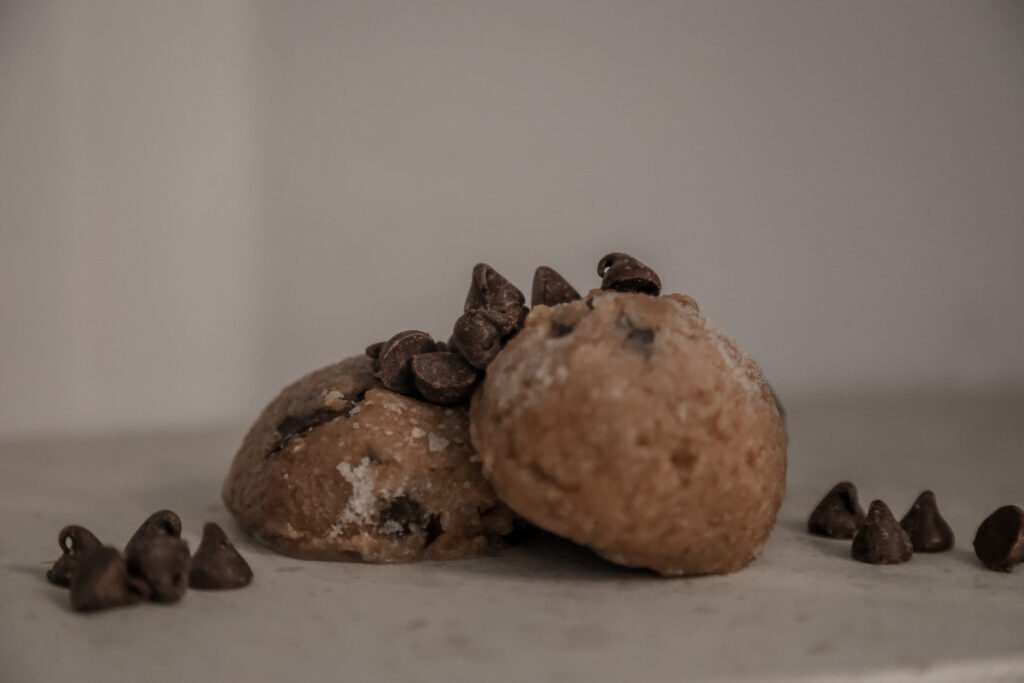 3 energy bites with chocolate chips sprinkled on top 