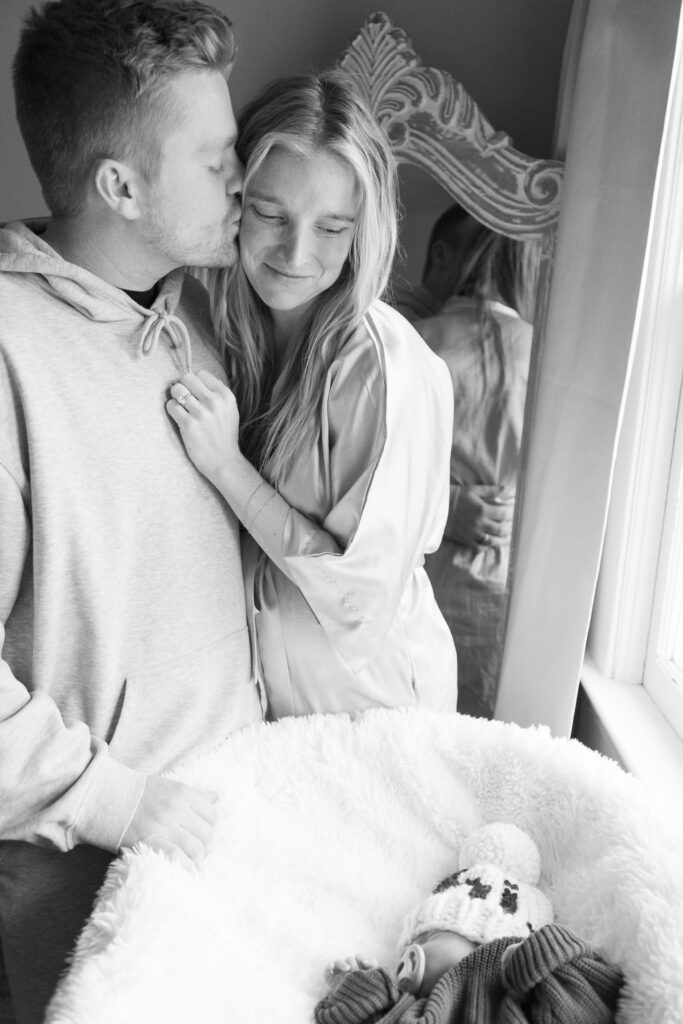 Mom and dad looking at their newborn son