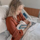 Mom in hospital bed looking at her newborn baby in her arms
