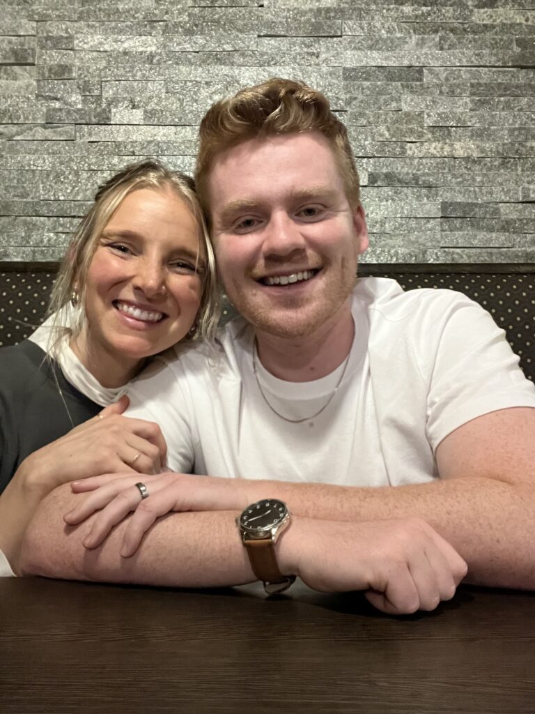 Husband and wife sitting in booth