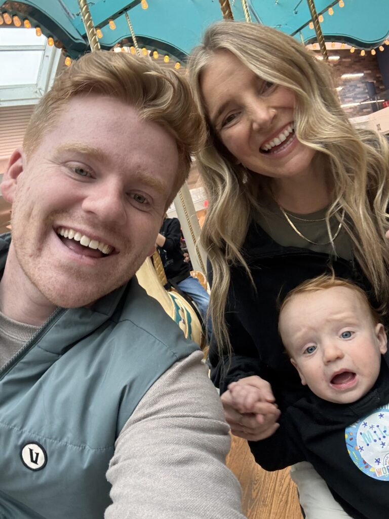 Mom and dad with their son on a carousel