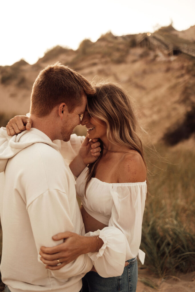 Husband and wife posing looking into each others eyes - prioritizing marriage 