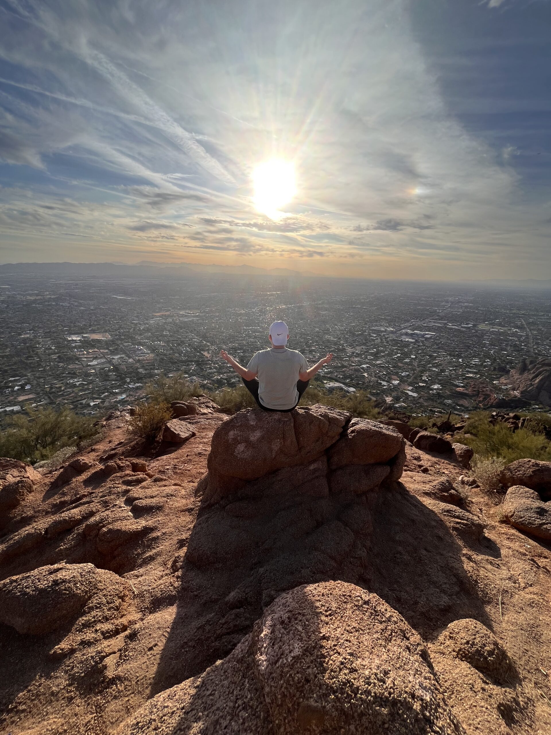 Dad pretending to meditate on a mountain in Arizona