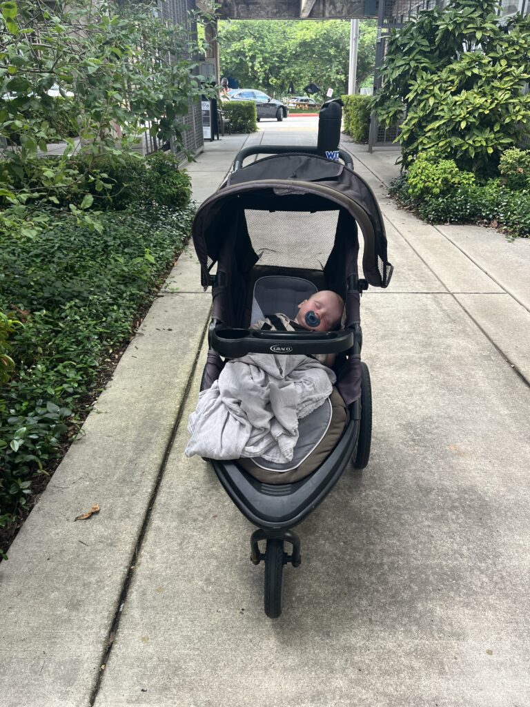 Baby sleeping in jogger stroller