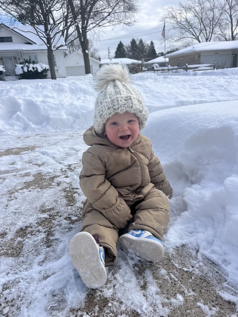 Cute baby bundled up in the snow