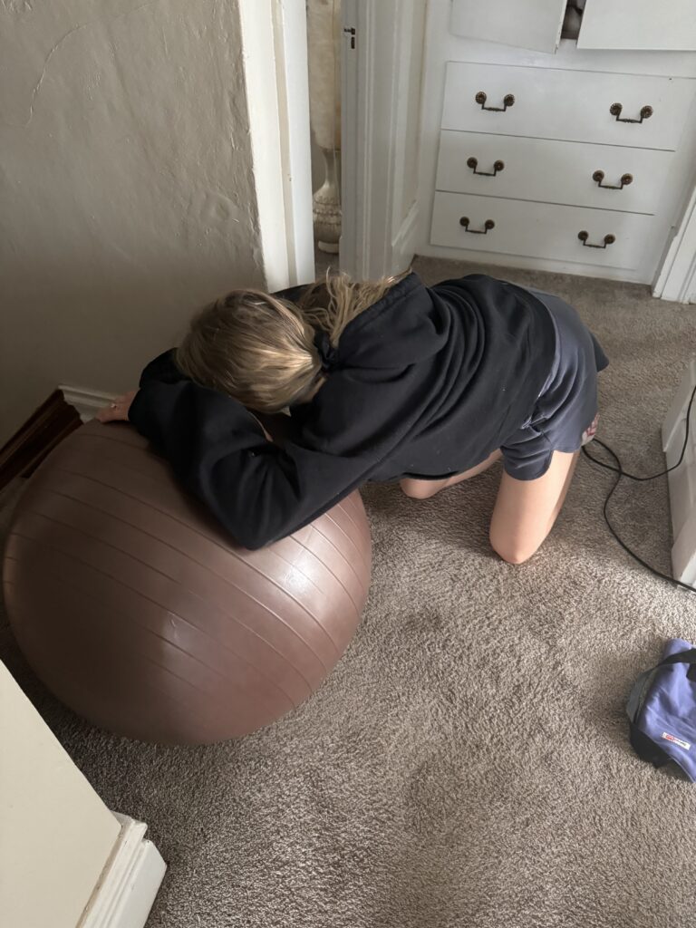 Mom laboring on birth ball